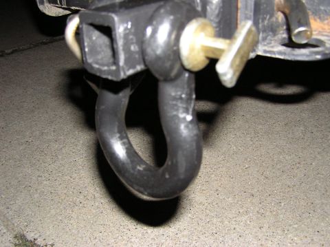 2000 Chevrolet Tahoe - A tow hitch shackle is secured with a pin, ready for towing.