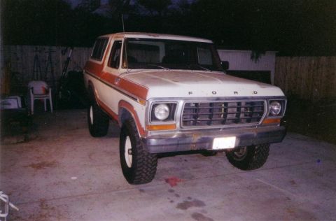 1978 Ford Bronco - This 1978 Ford Bronco is shown in a driveway with a white and orange paint scheme.
