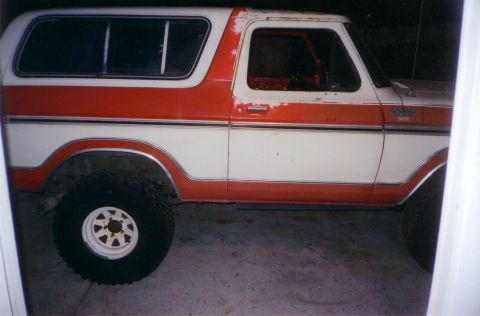 1978 Ford Bronco - This two-tone white and orange Ford Bronco appears to be in original condition, showing some wear and tear.