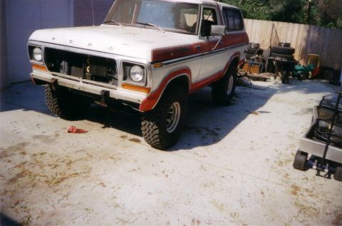 1978 Ford Bronco - This 1978 Ford Bronco is parked outside with its front grille removed.