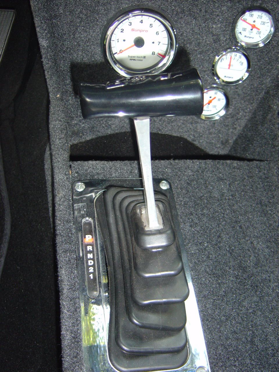 The B&M floor shifter to go along with the C4 Tranny.