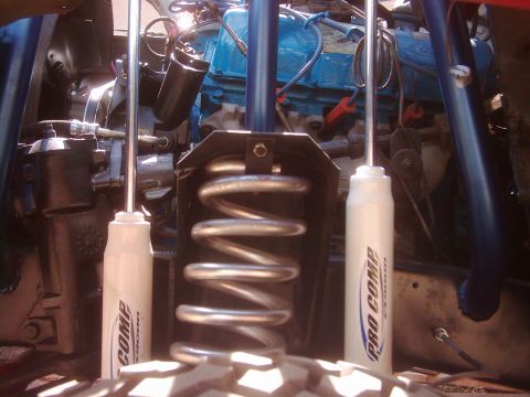 1978 Ford Bronco - Engine bay details with Pro Comp shocks and a visible coil spring.