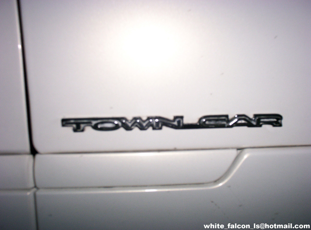 TOWN CAR badge on white vehicle