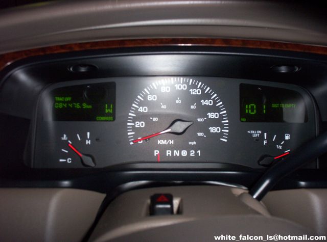 1999 Mercury Grand Marquis dashboard with speedometer, odometer, fuel gauge, and temperature gauge visible