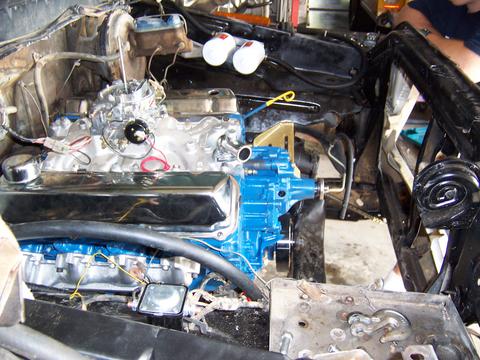 1979 Ford F-150 - Close-up of a V8 engine installation in a vehicle, showing various components and wiring.