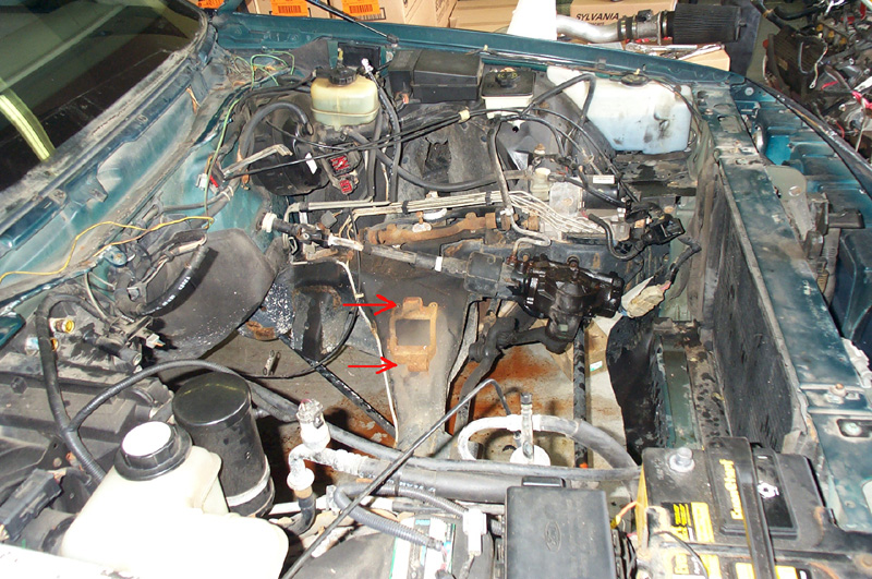 Drivers side engine mount pad
The arrows point to where the bolt heads are located.