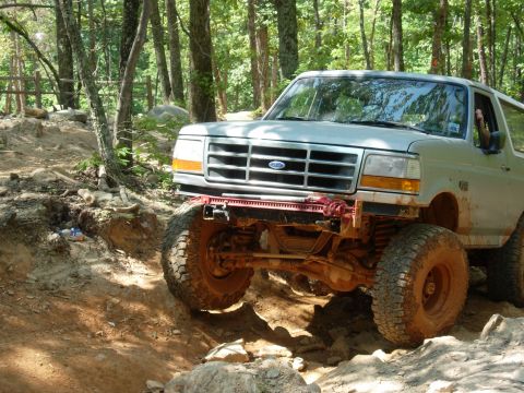 1995 Ford Bronco - This 1995 Ford Bronco is tackling a challenging rocky terrain during an off-road excursion.