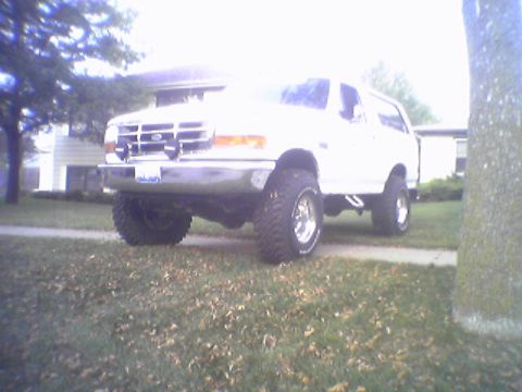 1993 Ford Bronco - This 1993 Ford Bronco is parked on a grassy area in front of a house.