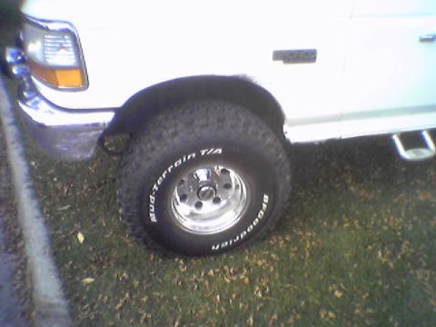 1993 Ford Bronco - This photo shows the front wheel and fender of a white Ford Bronco, BFGoodrich Mud-Terrain T/A tires.