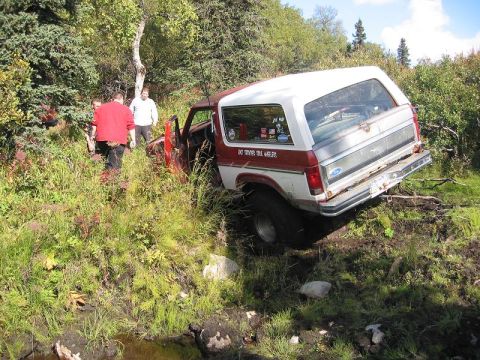 1985 Ford Bronco - Getting Caught on a stump in a really soft spot, getting ready to pull cable.