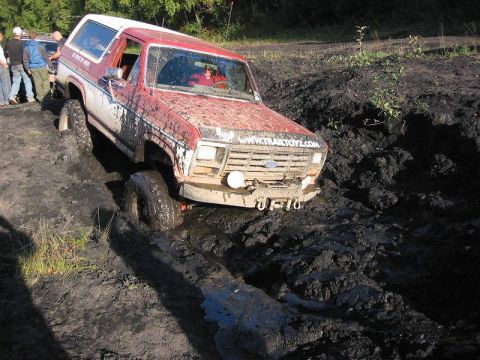 1985 Ford Bronco - DOH.. Truck is sinking, Better hurry and pull it out... 1 Winch cable and 15 mins later, it's out and on dry land again.