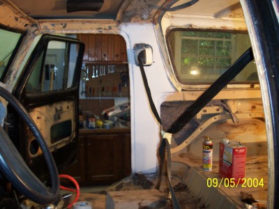 1979 Ford Bronco - The interior of a vehicle shows signs of repair work, with tools visible in the background.