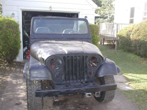 1979 Ford Bronco II - This Jeep CJ-5 is missing its headlights and grille inserts, and appears to be undergoing restoration.