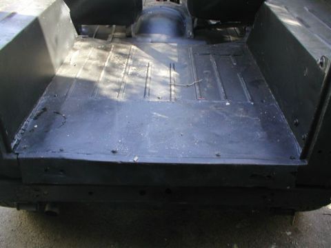 1979 Ford Bronco II - The interior floor of a vehicle appears to be undergoing restoration or repair.