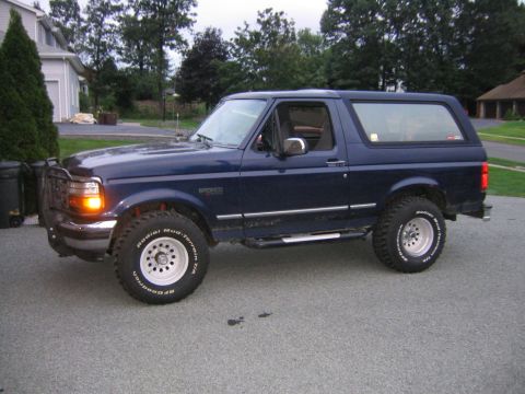 1994 Ford Bronco - This Ford Bronco is parked outside a residential garage.