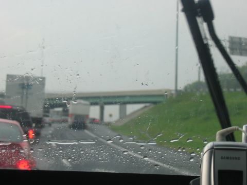 1988 Ford Bronco - A rainy day traffic jam on the highway, seen from inside a vehicle.