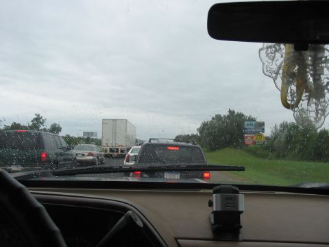 1988 Ford Bronco - Stuck in traffic on the highway during a cloudy day.