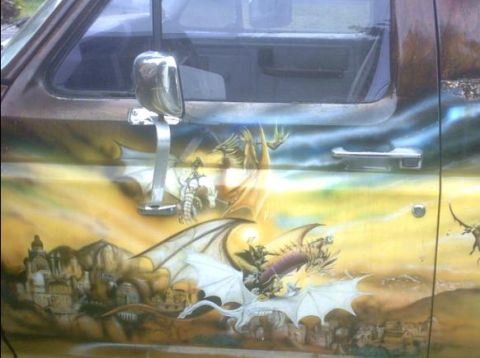 1992 Ford Bronco - Vehicle door features an elaborate airbrushed mural of dragons and a castle.