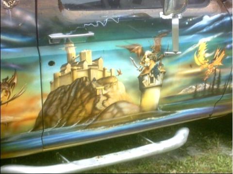 1992 Ford Bronco - This vehicle features custom airbrush art depicting a fantasy scene with a castle and dragons.