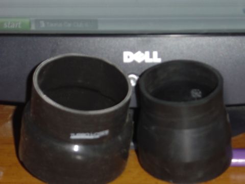 1998 Ford Taurus - Two black silicone couplers are shown, one with "TURBOLOOPS" text, against a computer monitor background.