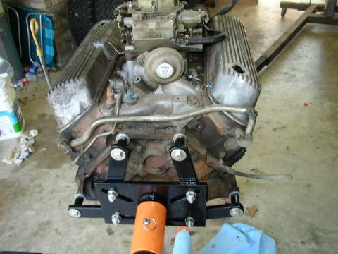 1995 Ford Bronco - A V8 engine is mounted on an engine stand, ready for work or transport.