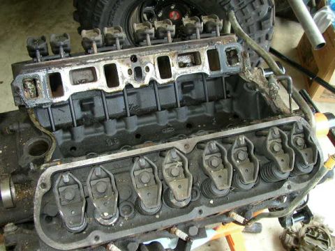 1995 Ford Bronco - Close-up view of an engine block, showing the valve train components and intake manifold.