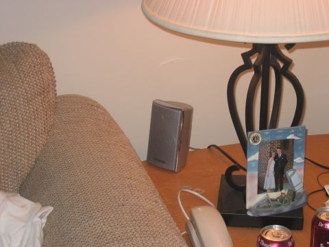 1988 Ford Bronco - A framed photo sits on a table next to a lamp and a small speaker.