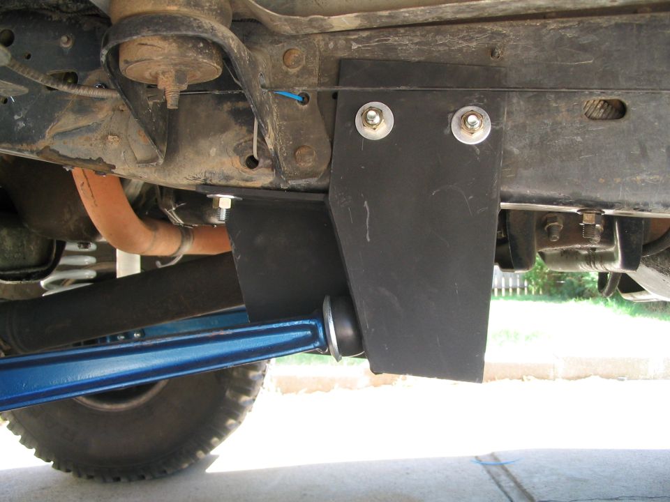 Undercarriage with black bracket, blue control arm, and frame components