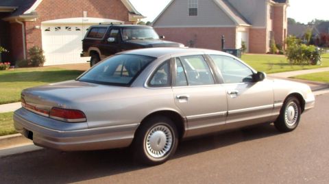 1994 Ford Crown Victoria - This silver sedan appears to be a 1995 model, not a 1994 as claimed.