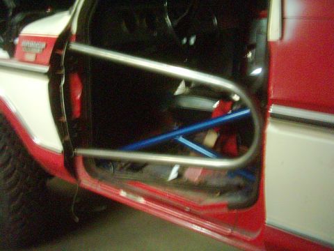 1978 Ford Bronco - This 1978 Ford Bronco features a custom roll cage and tube doors, visible through the open driver's side.