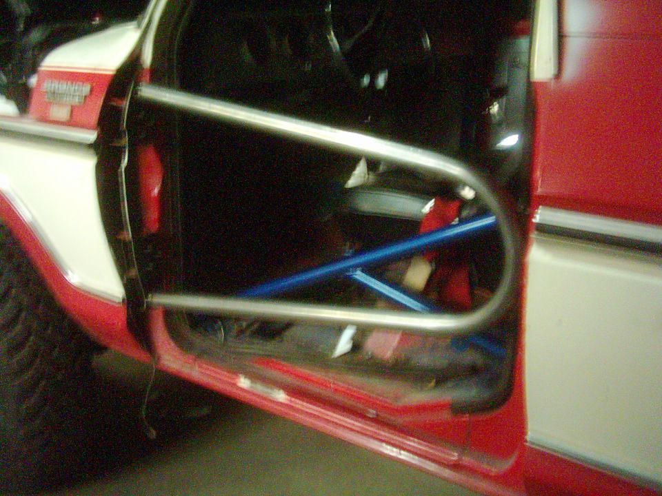Interior of a 1978 Ford Bronco with tube doors and roll cage