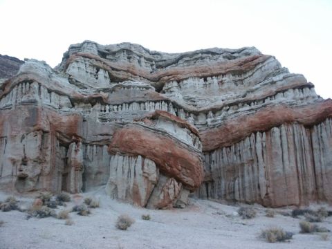 1996 Ford Bronco - The image shows layered sandstone formations with red and white strata, characteristic of desert landscapes.