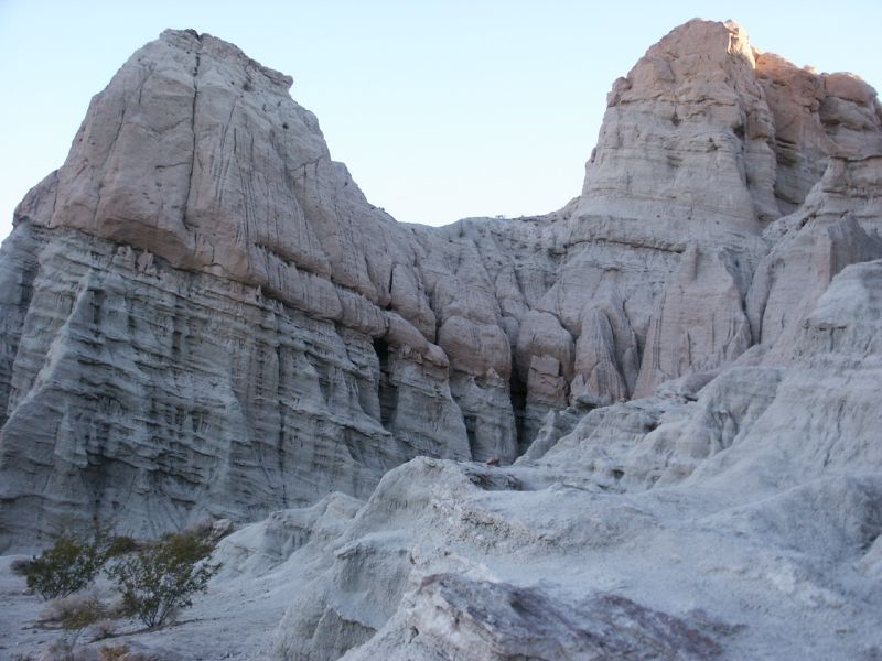 Rock formations in a desert landscape with a "SUPERMOTORS" watermark