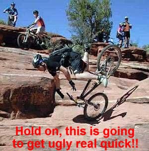 1995 Ford Bronco - A mountain biker is falling off their bike on a rocky trail, with other bikers in the background.