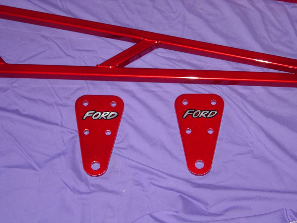 Red metal frame with two red Ford plates