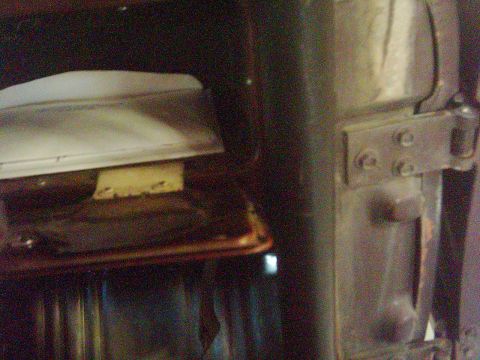1978 Ford Bronco - Close-up view of the interior door hinge and latch mechanism.