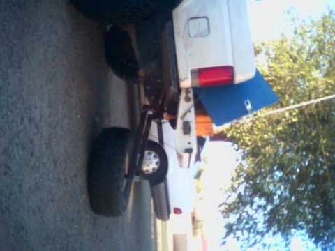 1987 Ford Bronco - Rear view of a 1987 Ford Bronco, showing the tire carrier and spare tire.