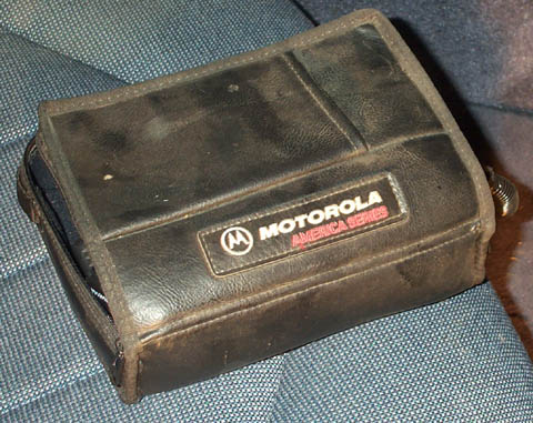 1995 Ford Crown Victoria - A black Motorola America Series case is shown resting on a blue fabric surface.