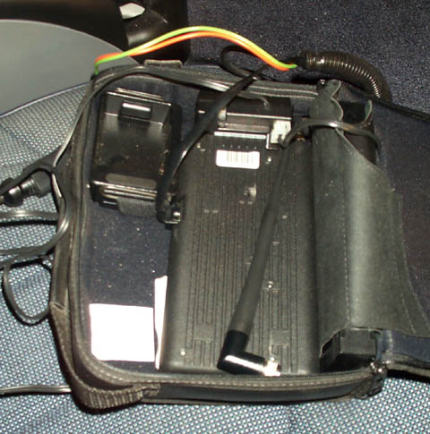 1995 Ford Crown Victoria - Bag containing car electronics and wiring, with a black antenna visible.
