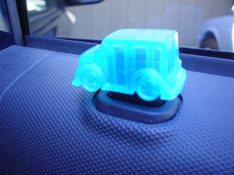 1993 Ford Taurus - A blue plastic car air freshener sits on a car's dashboard.