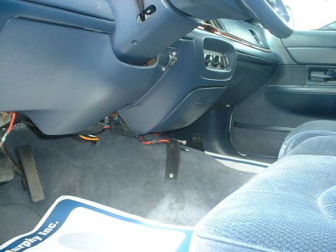 1999 Ford Crown Victoria - Interior. Note the radio brackets on the tranny hump and the mic clip next to the steering colum.