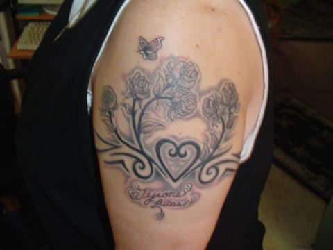 1993 Ford Bronco - A tattoo design roses, a heart, and a butterfly is shown on a person's arm.