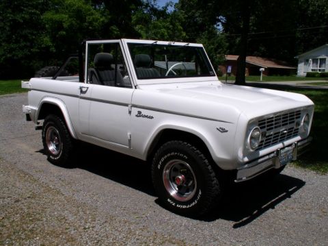 1967 Ford Bronco - This classic 1967 Ford Bronco convertible is shown from a three-quarter front angle on a sunny day.