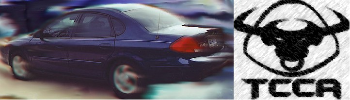 Dark blue sedan, 2000 Ford Taurus, rear view, motion blur, spoiler, TCCA logo