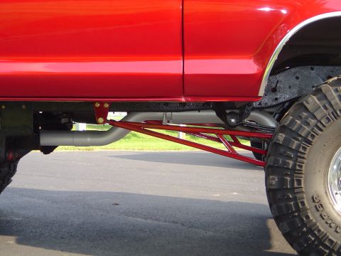 1978 Ford Bronco - Custom suspension on a 1978 Ford Bronco, focusing on the rear wheel and chassis.