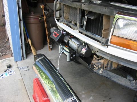 1995 Ford Bronco - The front of a 1992 Ford Bronco shows a WARN winch mounted to the bumper and grille area.