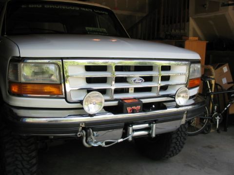 1995 Ford Bronco - Front view of a 1995 Ford Bronco equipped with a winch and auxiliary lights.