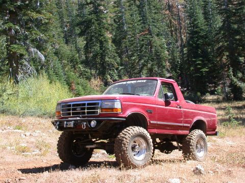 1996 Ford Bronco - This lifted 1996 Ford Bronco is ready for off-road adventures in a wooded area.