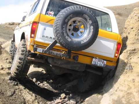 1995 Ford Bronco - Ford Bronco navigating a steep, rocky off-road trail.