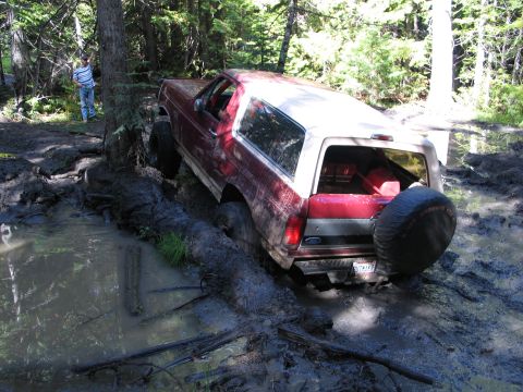1995 Ford Bronco - Carey in a tough spot. Body lift, sway bars, and baja claws, he never ceases to amaze me.